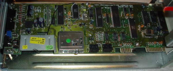 Another motherboard installed in the tower - or is this the grandmaboard? I was lucky to                   buy a newer model of the C64 the second time, C64C rev 4 - assy 250469 - the short board.                   The motherboard of the old C64 was a lot larger and would not have fit in the case.